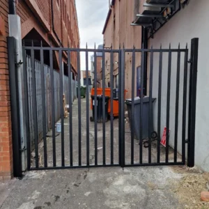 Black metal security gate alley London commercial