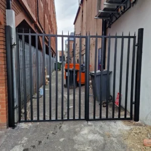 Black metal security gate rear alley London commercial