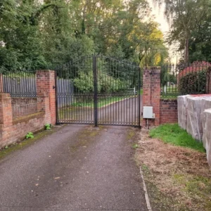 Black metal double driveway gates with railings, London