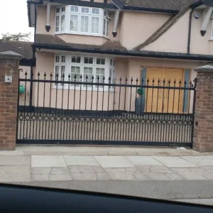 Black wrought iron railings and gates fronting London home