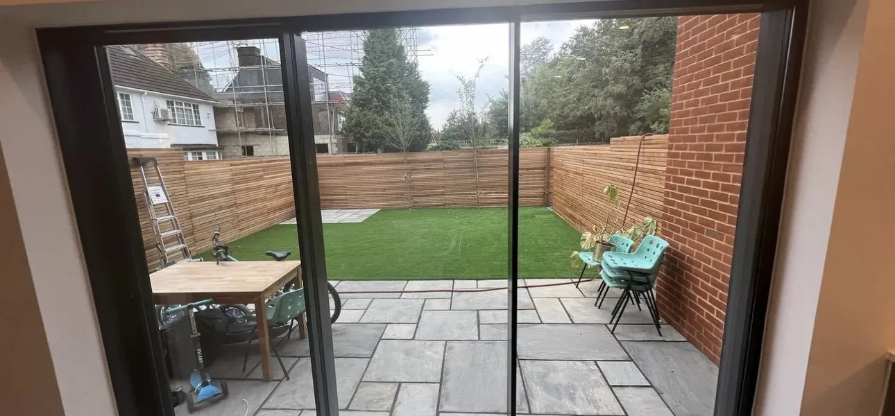 Anthracite aluminium sliding patio doors onto London garden