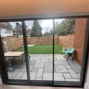Anthracite aluminium sliding patio doors onto London garden