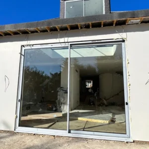 White aluminium sliding patio doors on London rear extension