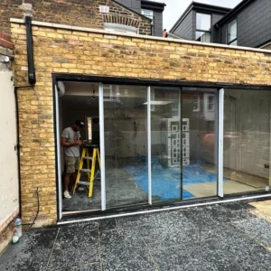 Aluminium sliding patio doors on London brick extension