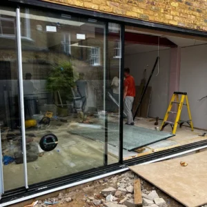 Aluminium sliding patio doors during London extension fit