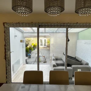 Aluminium sliding doors to London conservatory from dining area
