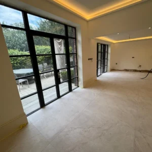 Black framed glazed garden screen in London extension room