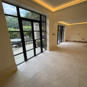 Black framed glazed wall to garden patio, London