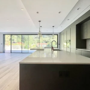 Large aluminium sliding doors to garden, London kitchen