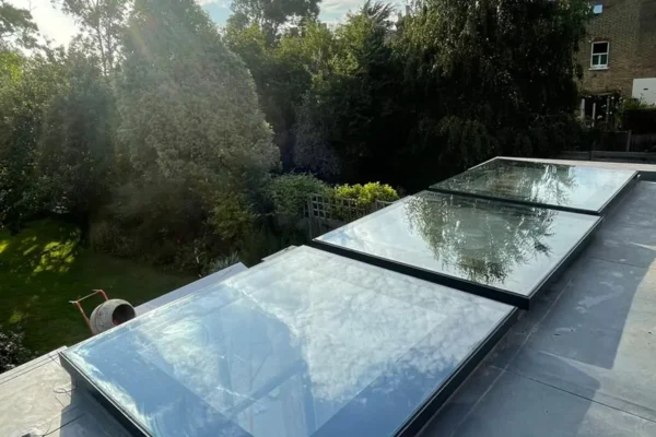 Twin glass rooflights on London flat-roof rear extension