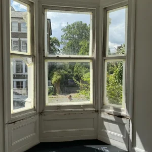 Timber sash bay window in London period property