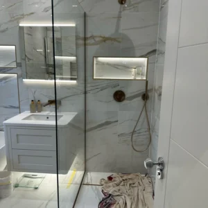 Frameless walk-in glass shower screen, London marble bathroom