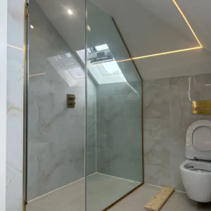 Walk-in glass shower panel London loft bathroom