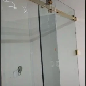 Sliding glass shower screen with brass hardware London