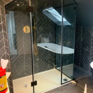 Black-framed glass shower enclosure London loft bathroom