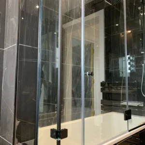 Black-framed glass over-bath shower screen London