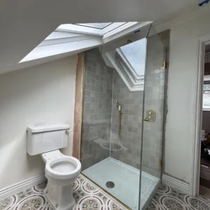 Frameless glass corner shower screen London loft bathroom