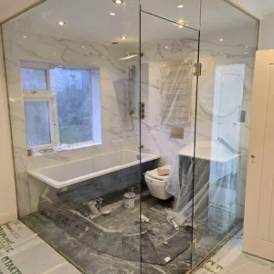 Floor-to-ceiling glass shower enclosure in London bathroom