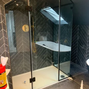 Glass shower enclosure with bath, London loft bathroom
