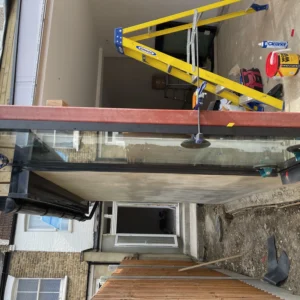 Frameless structural glass canopy on London rear extension