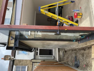 Frameless structural glass canopy on London rear extension