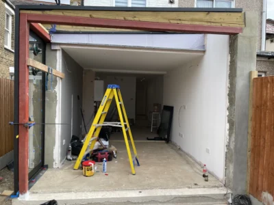 Frameless glass corner wall on London garden extension